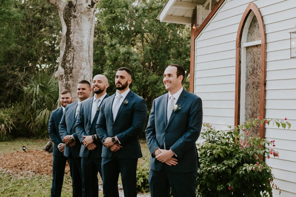 Groom reacts to aisle reveal outdoor ceremony