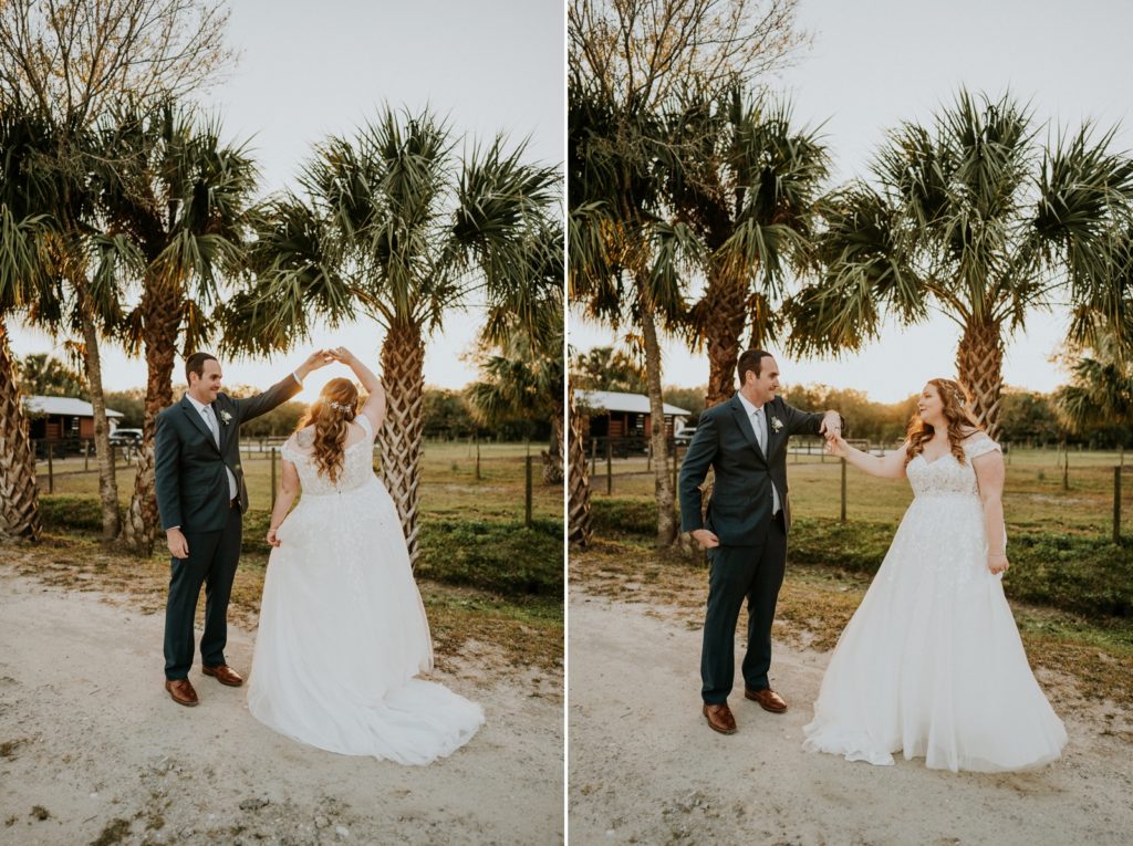 Groom spins bride under palm trees at sunset Florida wedding photography