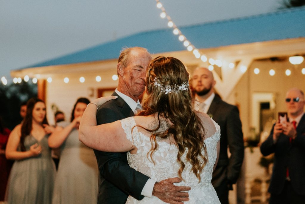 Father daughter dance under fairy lights