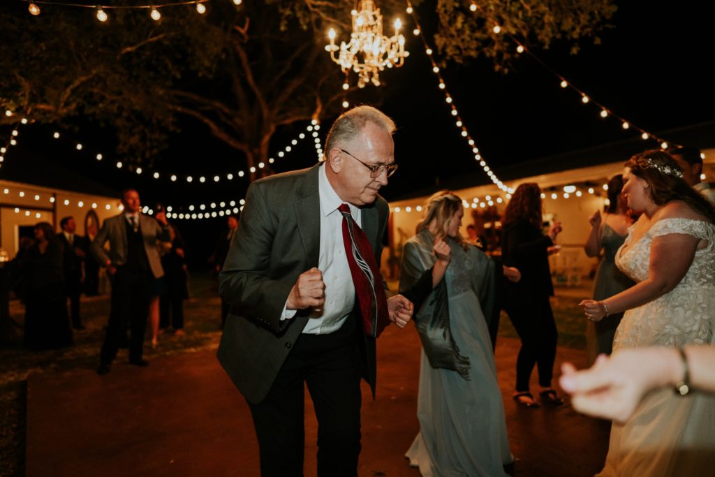 Wedding guest dancing at wedding reception