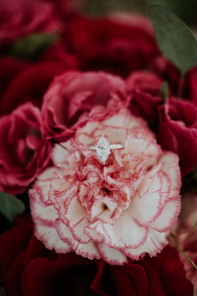 Stuart FL wedding photography bouquet with pink roses and marquis engagement ring in carnation