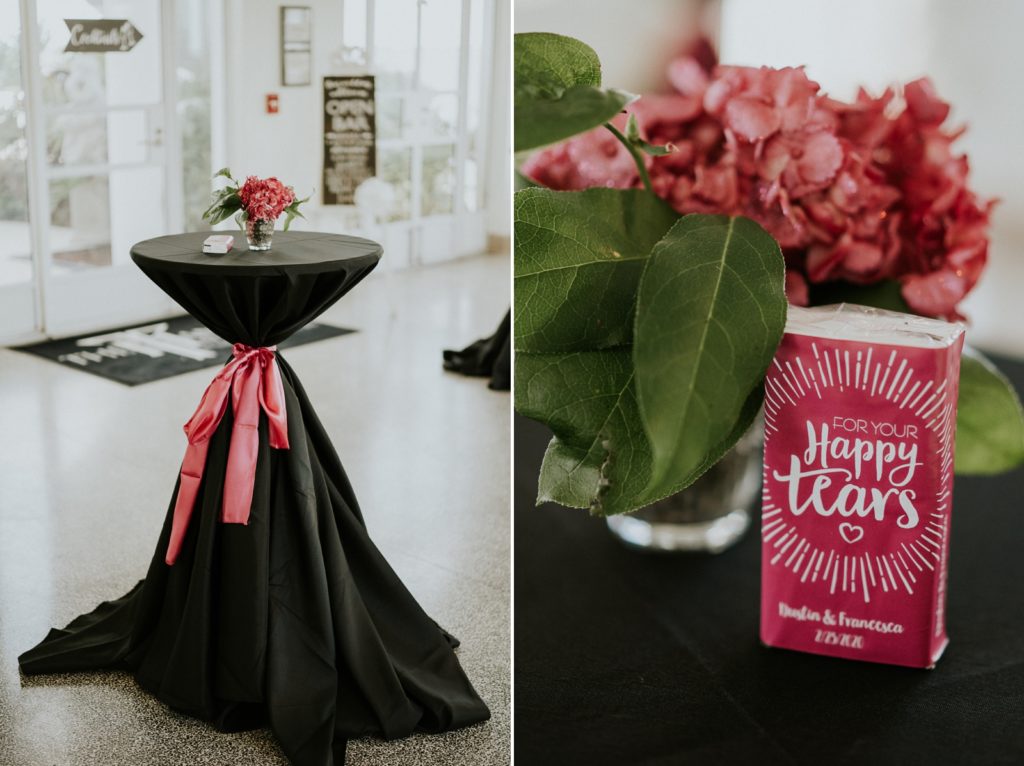 Black and pink cocktail wedding tables with tissues for happy tears
