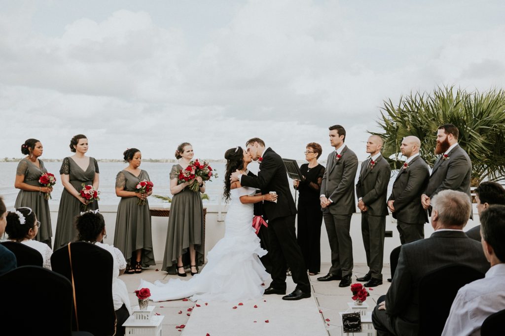 Tuckahoe Mansion wedding ceremony first kiss on balcony overlooking Jensen Beach intracoastal