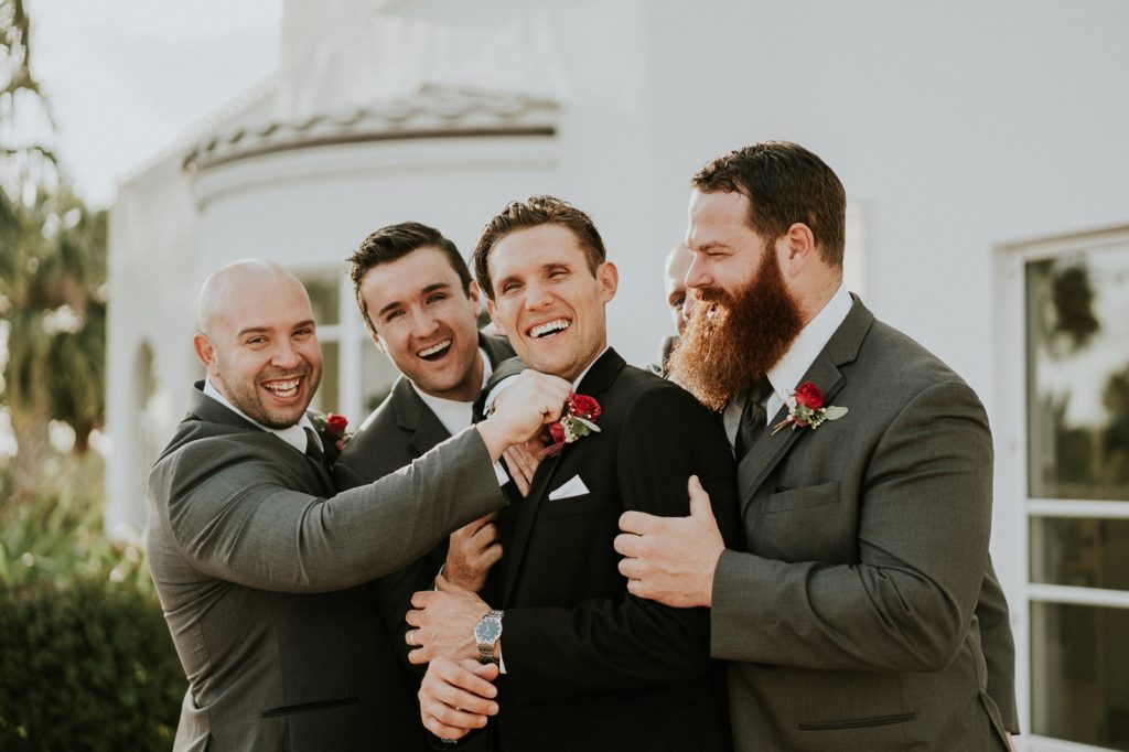 Tuckahoe Mansion wedding groomsmen hug groom Jensen Beach FL photography