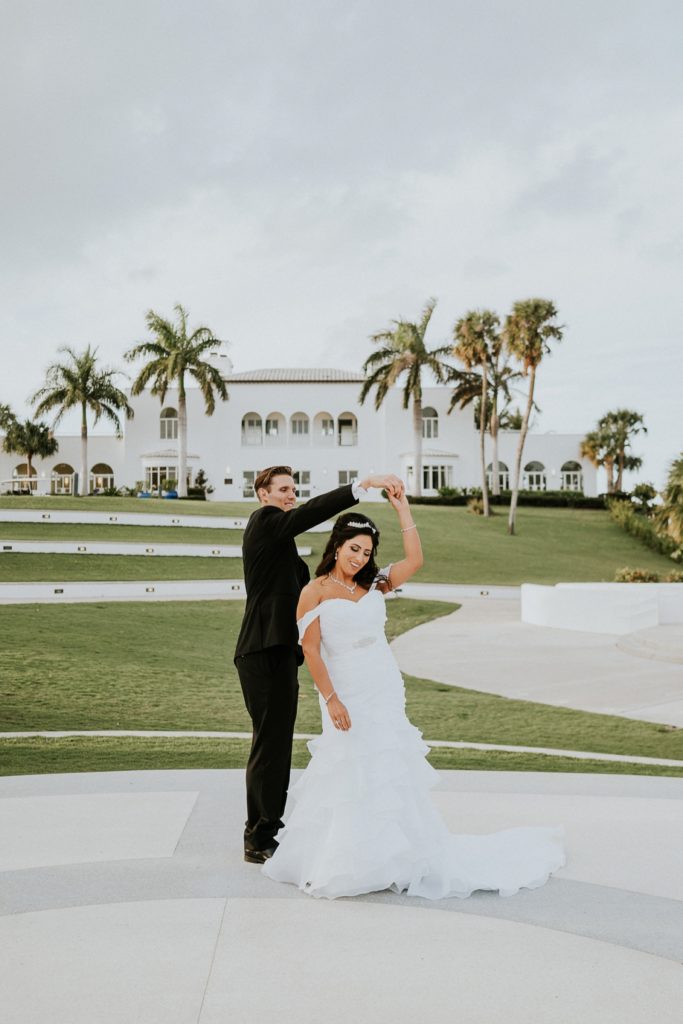 Couple dance in front of the Mansion at Tuckahoe Jensen Beach FL wedding photography