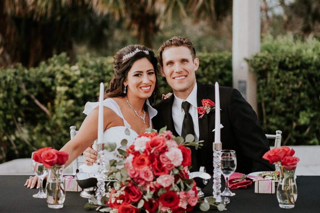 Tuckahoe Mansion wedding reception sweetheart table with pink roses and carnations