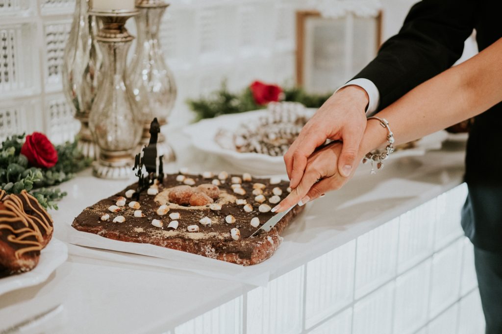 Vegan dessert table cake cutting Jensen Beach FL wedding photography