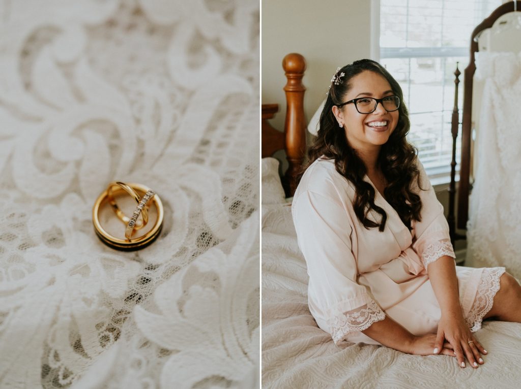 Kai Kai Farm wedding bridal suite with bride in light pink robe next to gold wedding rings on lace