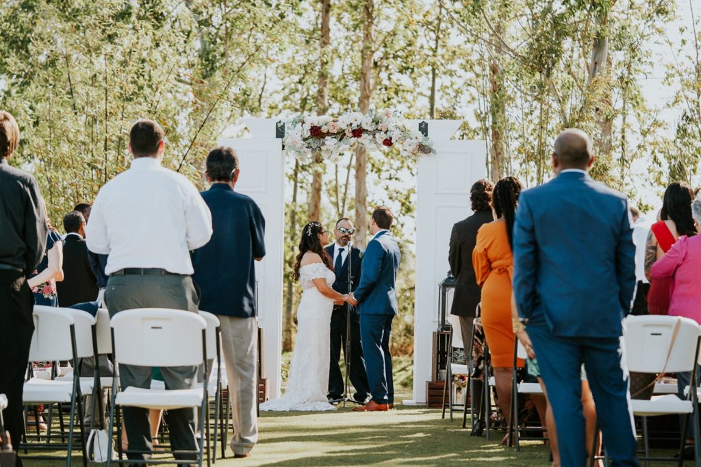 Florida farm wedding ceremony with door arch