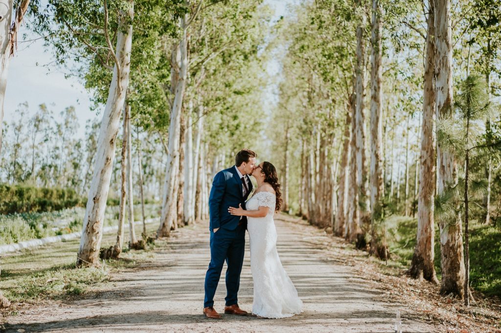 Kai Kai Farm wedding kiss in front of birch poplar trees