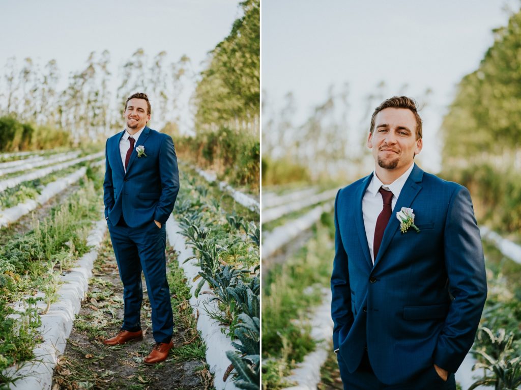 Kai Kai Farm wedding Stuart FL groom portrait in blue suit in greenery field