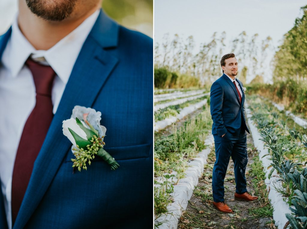 Kai Kai Farm wedding Stuart FL groom portrait in blue suit in greenery field