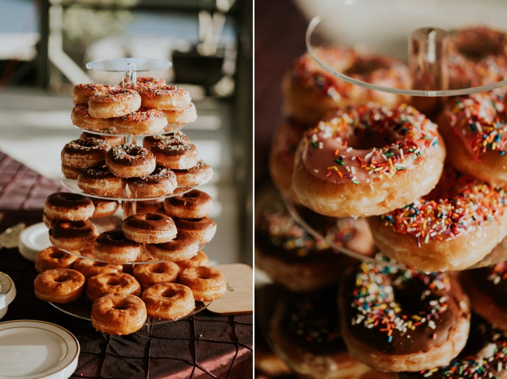 Wedding dessert donut display with pink and chocolate icing and sprinkles