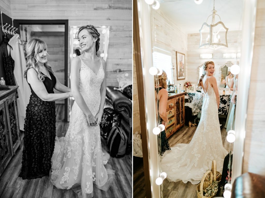 Mother of bride buttons wedding dress and bride looks in mirror