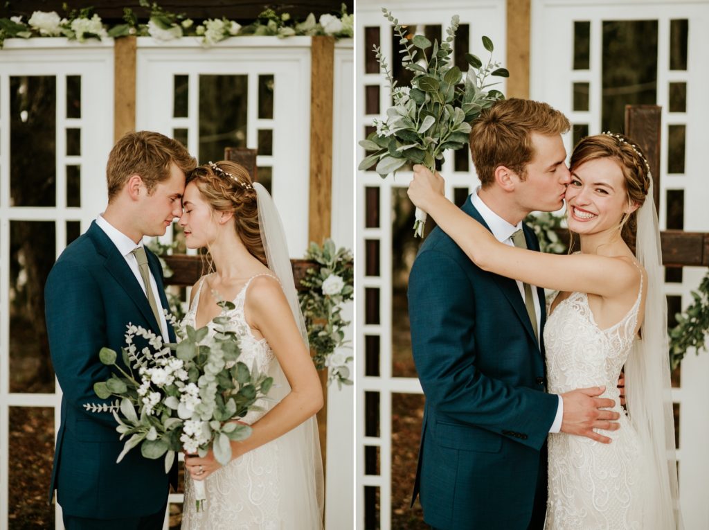 Bride and groom touch foreheads and he kisses her on cheek