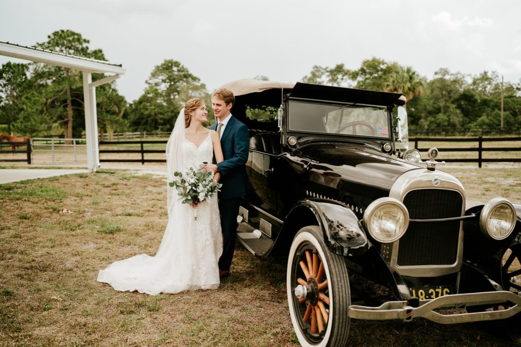 Ever After Farms Ranch wedding couple portraits with black classic car