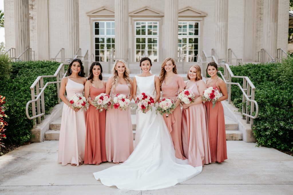 Family Church Downtown wedding photo of bride with bridesmaids in pink dresses