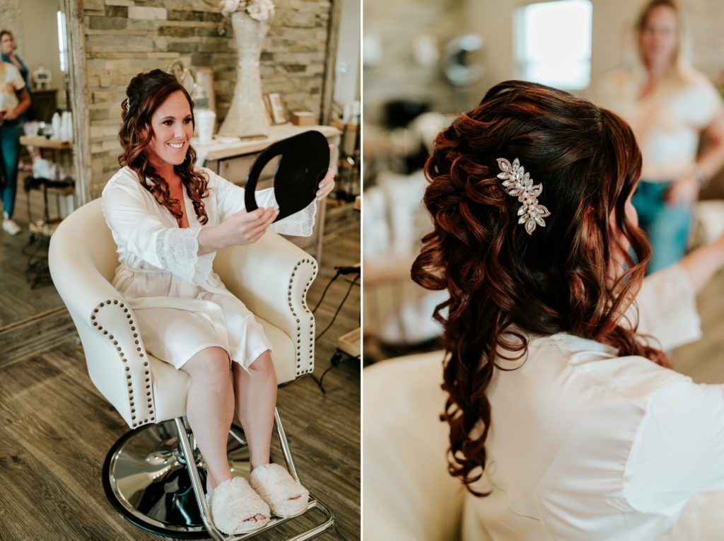 Bride looks at wedding hair in mirror at Pellegrino's Salon & Suite