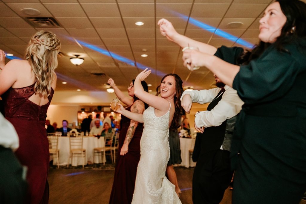 Bride line dancing at Bensalem Township Country Club wedding reception