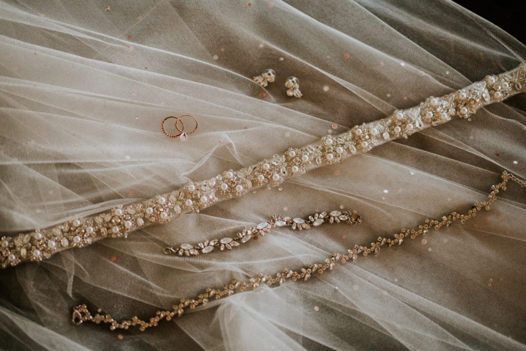 Bridal pearl wedding jewelry on rhinestone veil