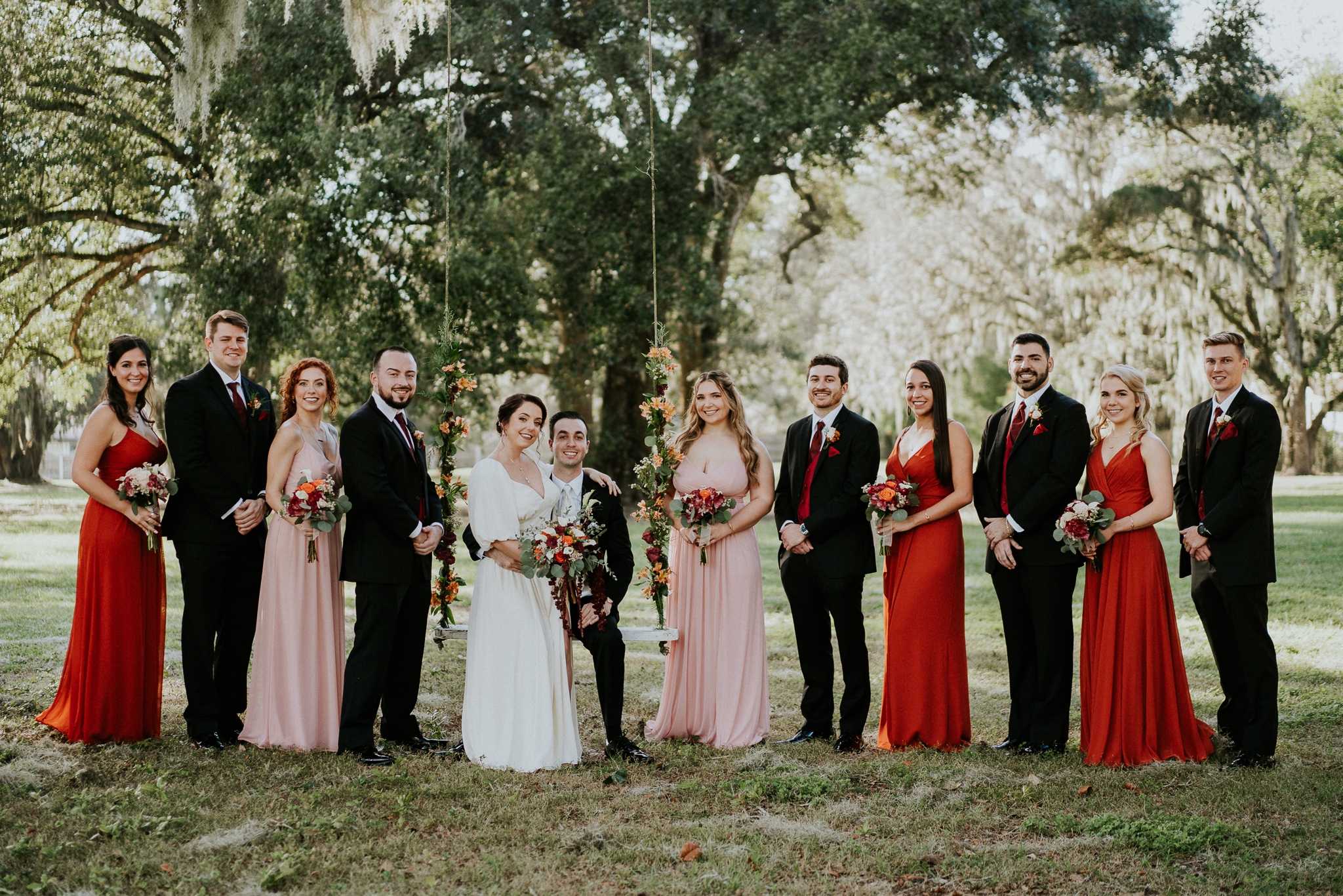 Casa Lantana wedding party on floral swing Stuart FL wedding photographer