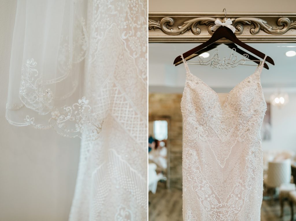 Lace detail of L&H Bridal wedding dress hanging on mirror