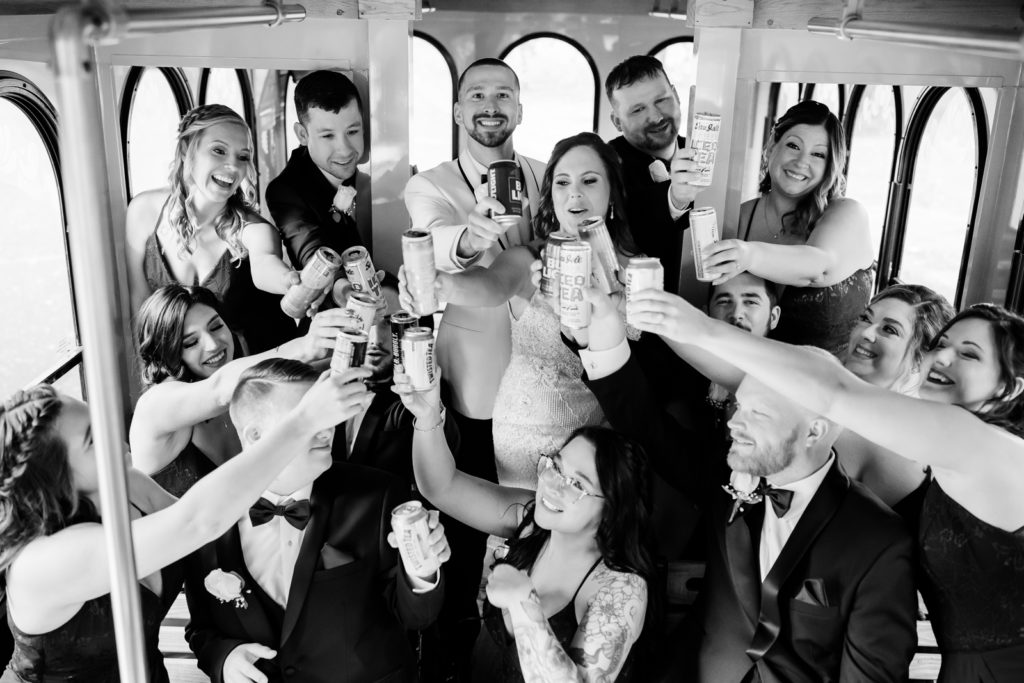 Wedding party toast drinks inside wedding trolley