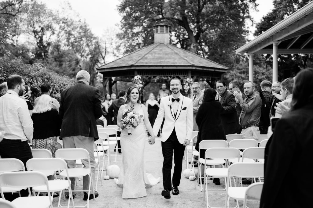 Bride and groom walk down the aisle after Bensalem Township Country Club wedding ceremony