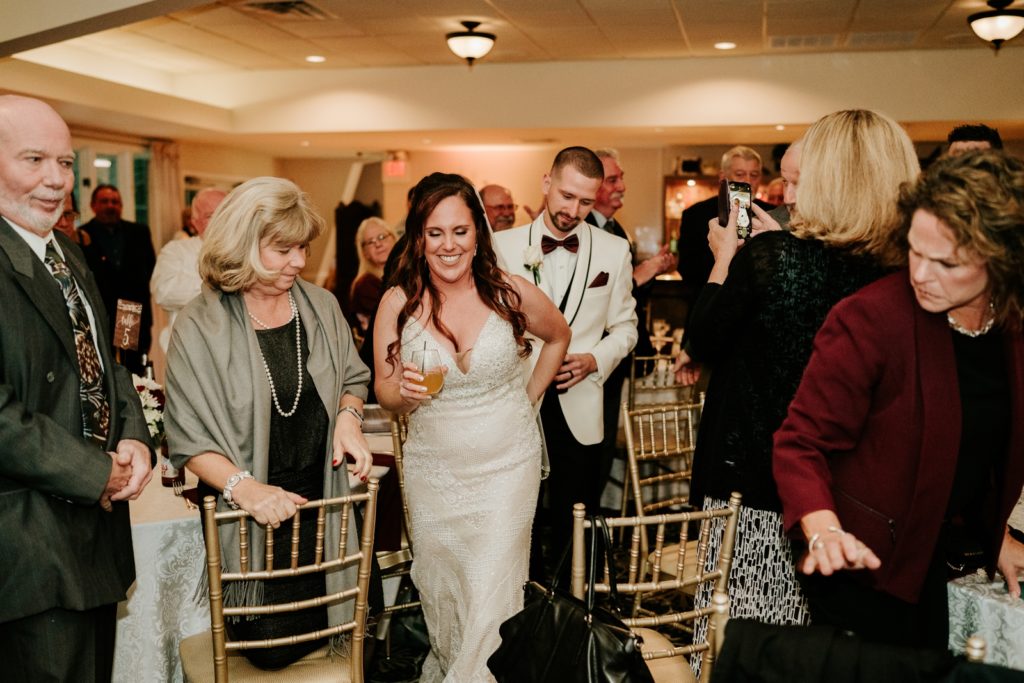 Bride leads groom to dance floor at Bensalem Township Country Club wedding reception