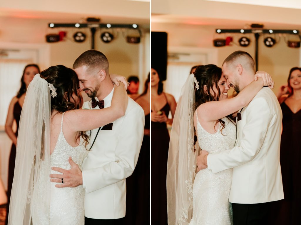 Bride and groom smile and hold each other close during first dance